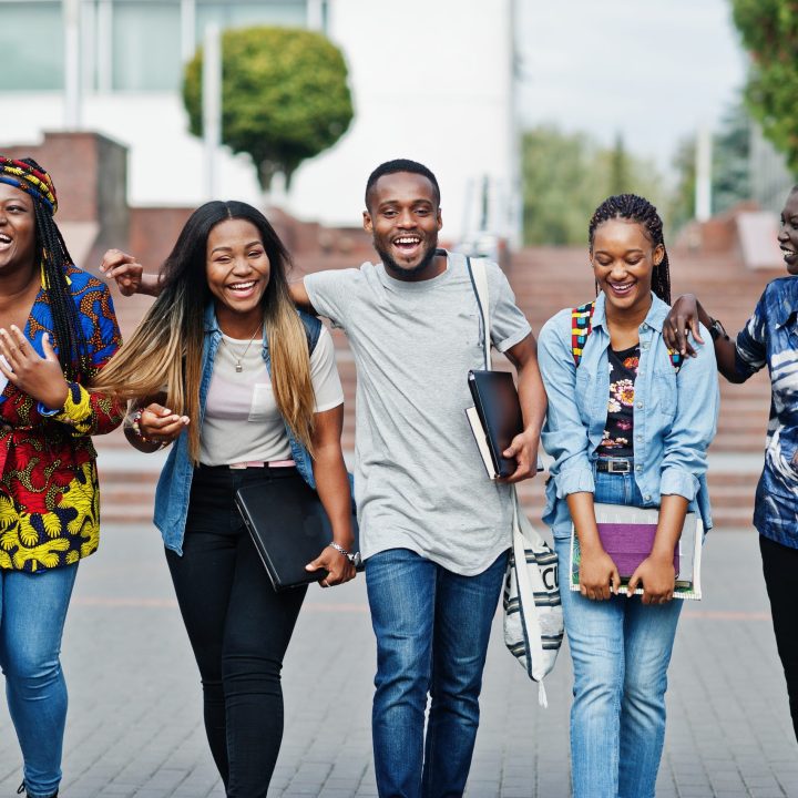Group of five african college students spending time together on Students