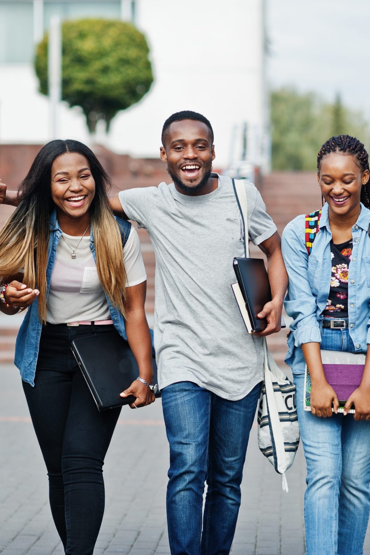 Group of five african college students spending time together on Students